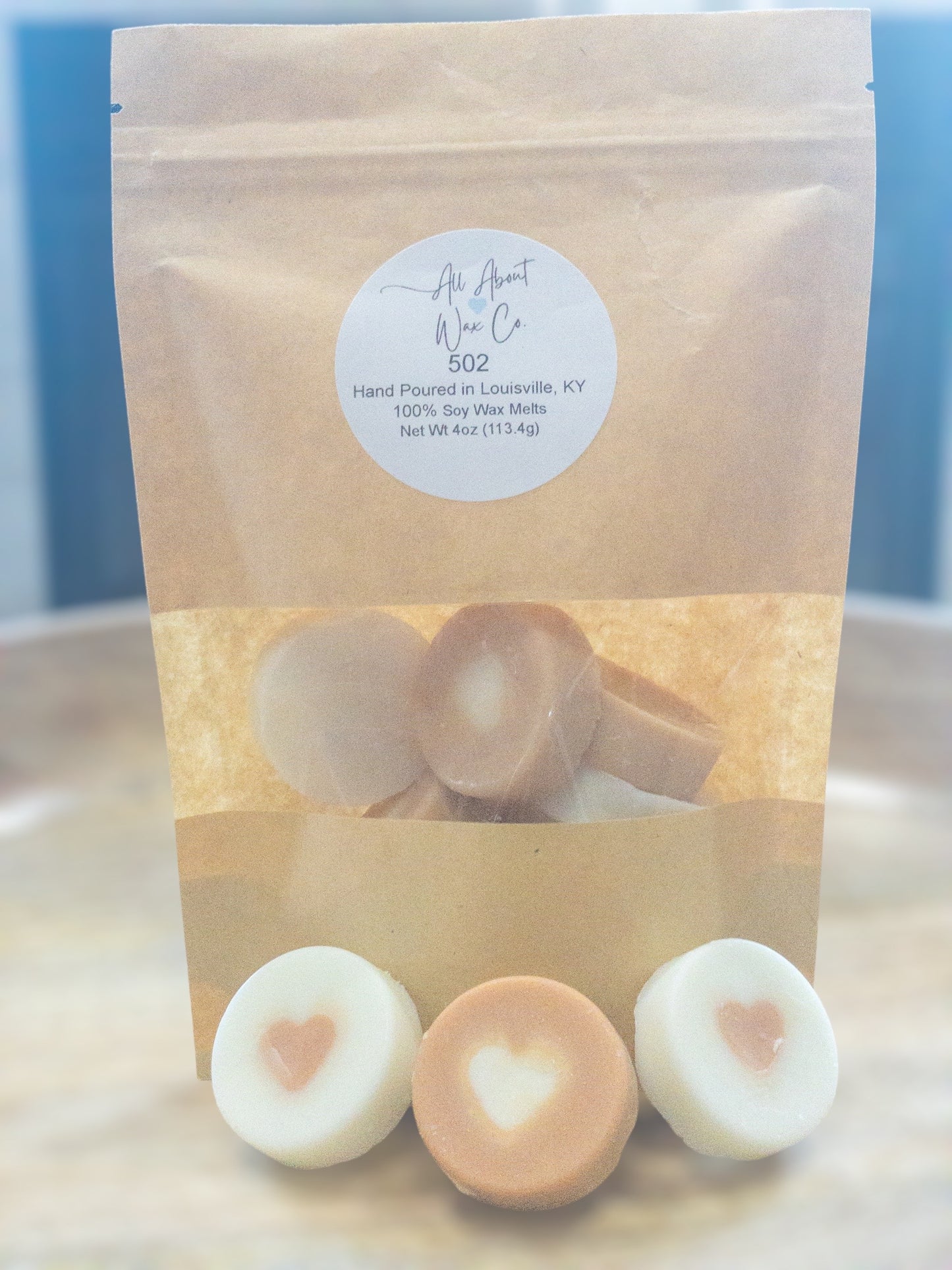 502 (Bourbon, Butterscotch, and Sweet Tobacco) Wax Melts, white and brown with a heart in the middle
