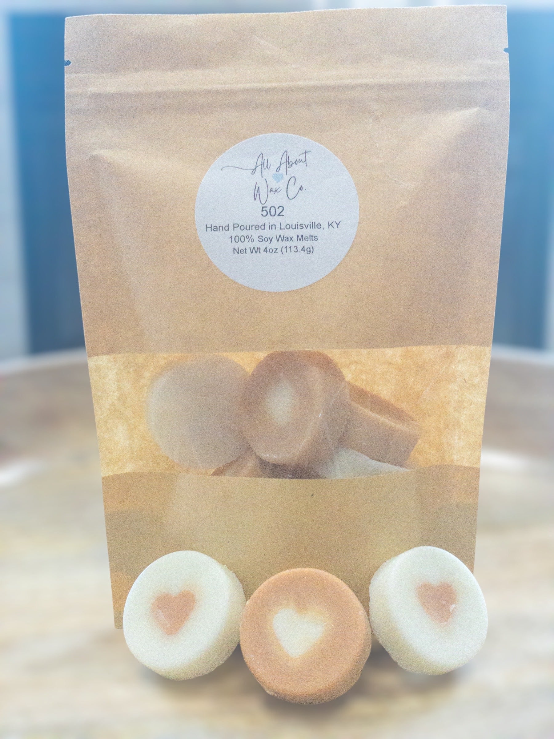 502 (Bourbon, Butterscotch, and Sweet Tobacco) Wax Melts, white and brown with a heart in the middle