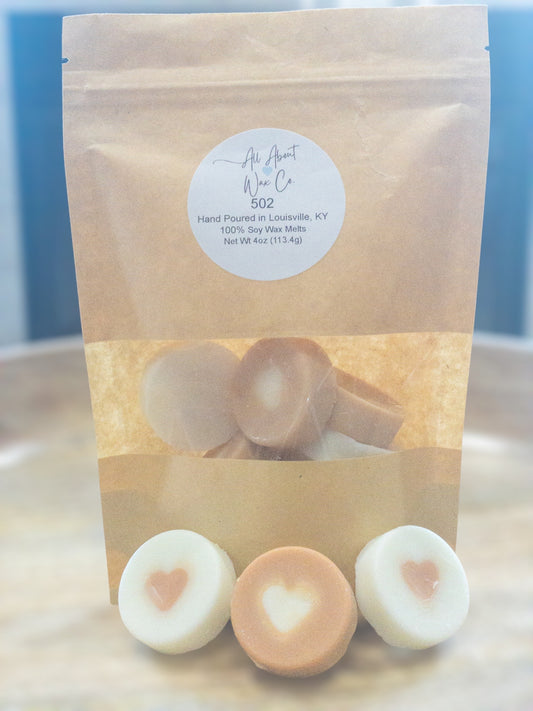502 (Bourbon, Butterscotch, and Sweet Tobacco) Wax Melts, white and brown with a heart in the middle